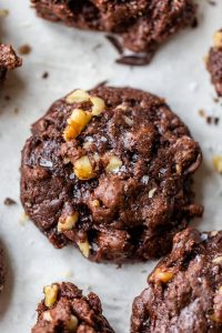 a close up of salted brownie cookies with nuts